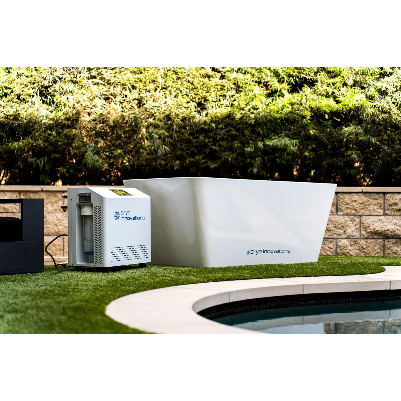 Cryo Innovations XR Cryo Plunge acrylic tub and chiller/heater beside a pool