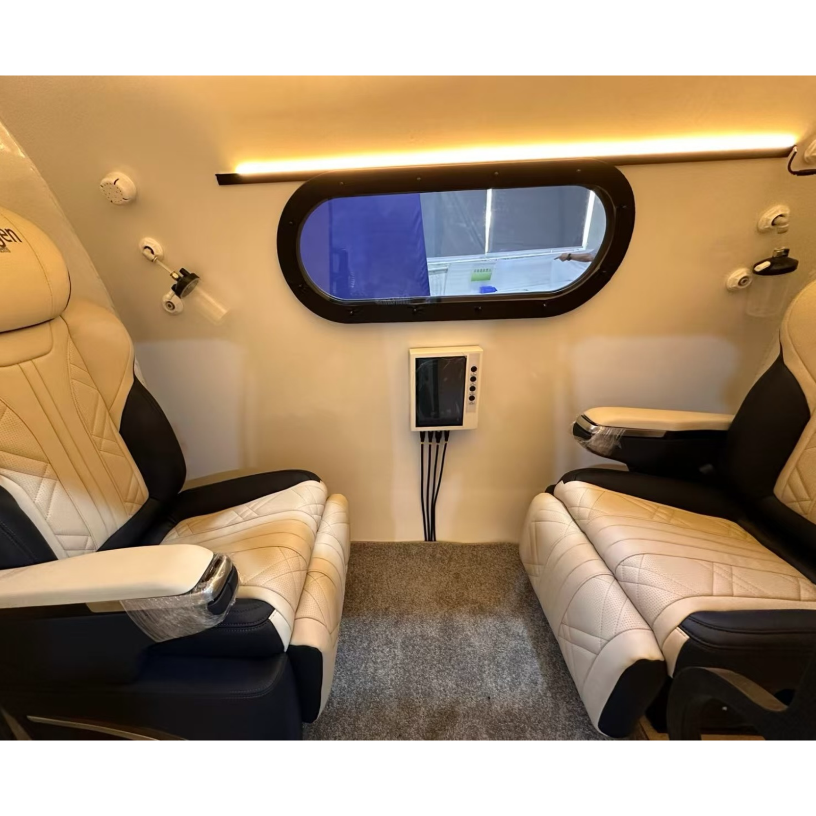 Macy-Pan HE5000 Fort Two-Person Hard-Shell Hyperbaric Chamber – interior with two seats and an oval window