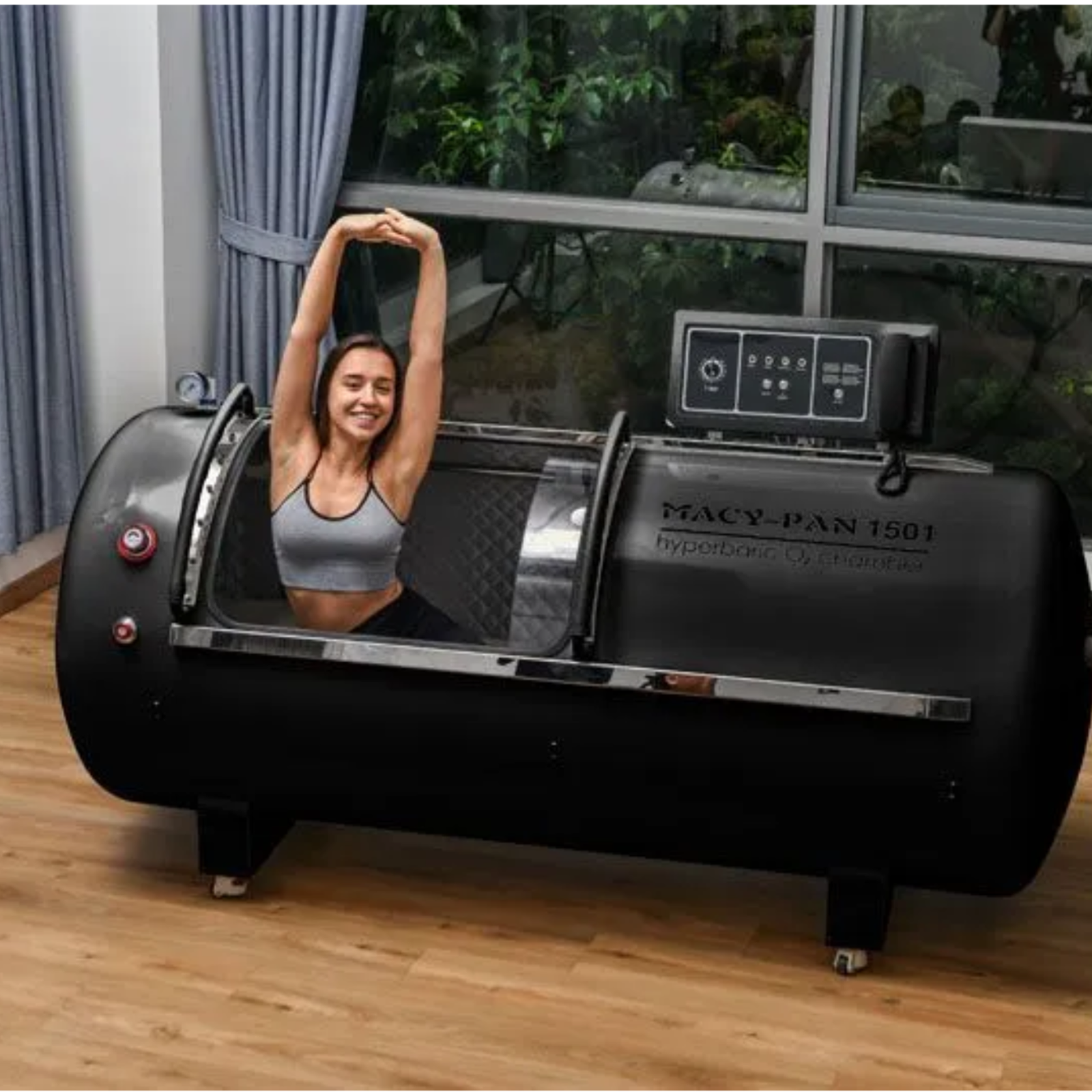 Macy-Pan HP1501 Hard-Shell Lying Hyperbaric Chamber – woman stretching inside the black chamber