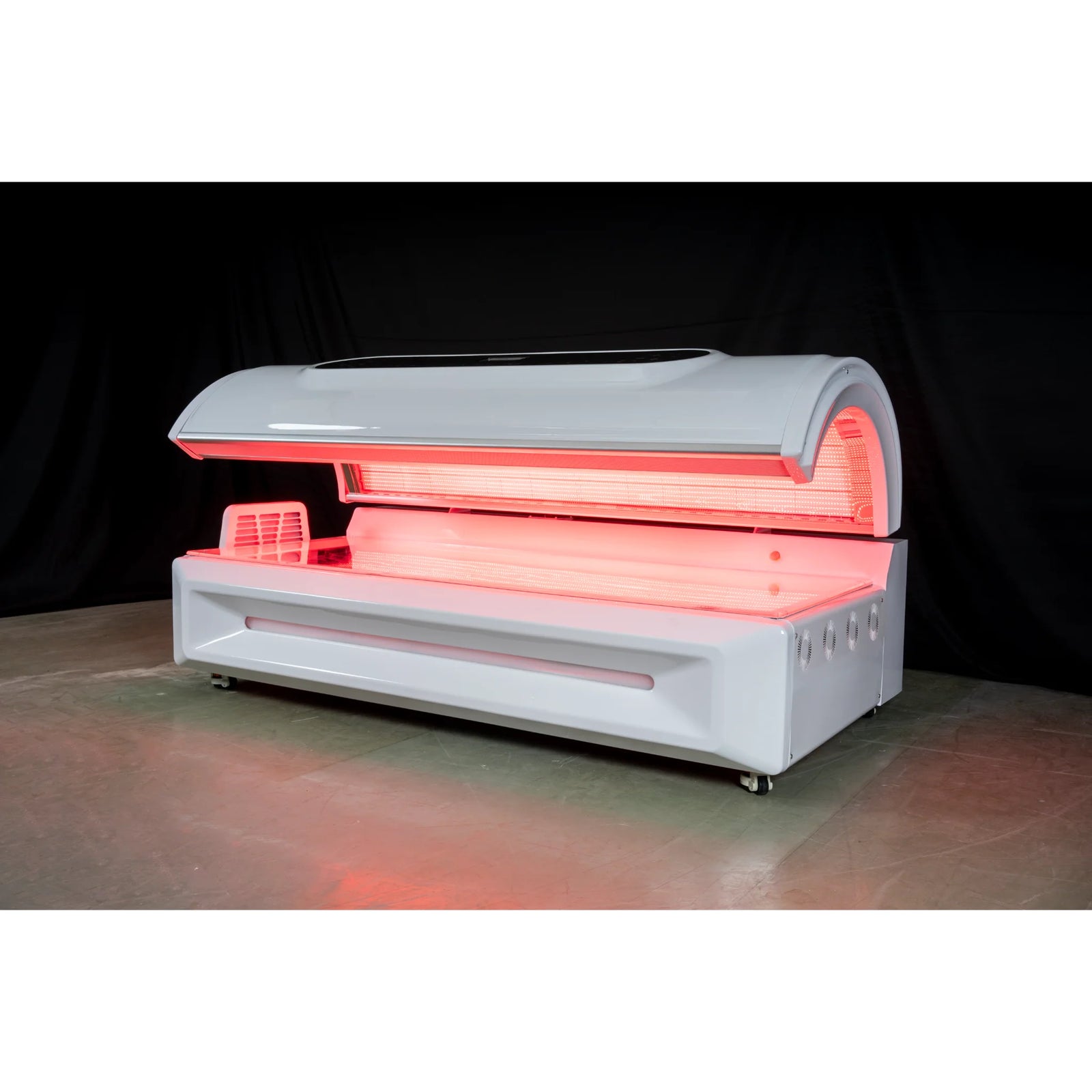 Merican M5 Whole-Body Red Light Therapy Bed – white bed with the canopy open in a dark studio