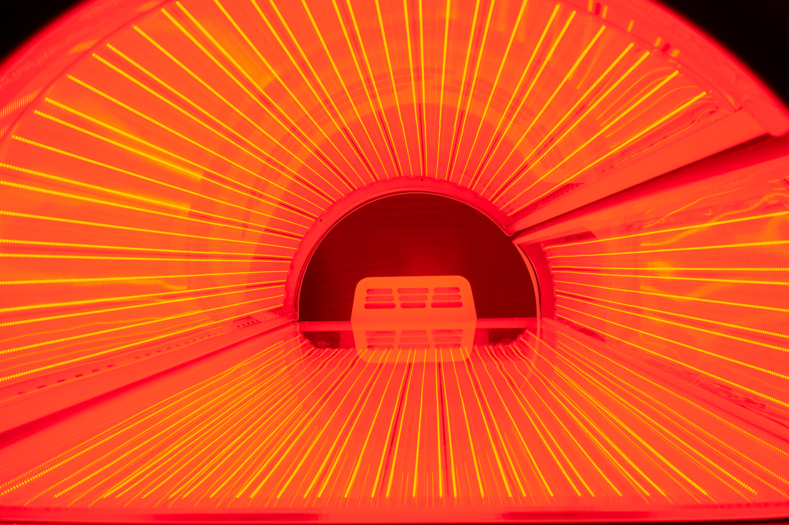 Merican M6N Plus Whole-Body Red Light Therapy Bed – view down the bed tunnel with the red LED arrays lit