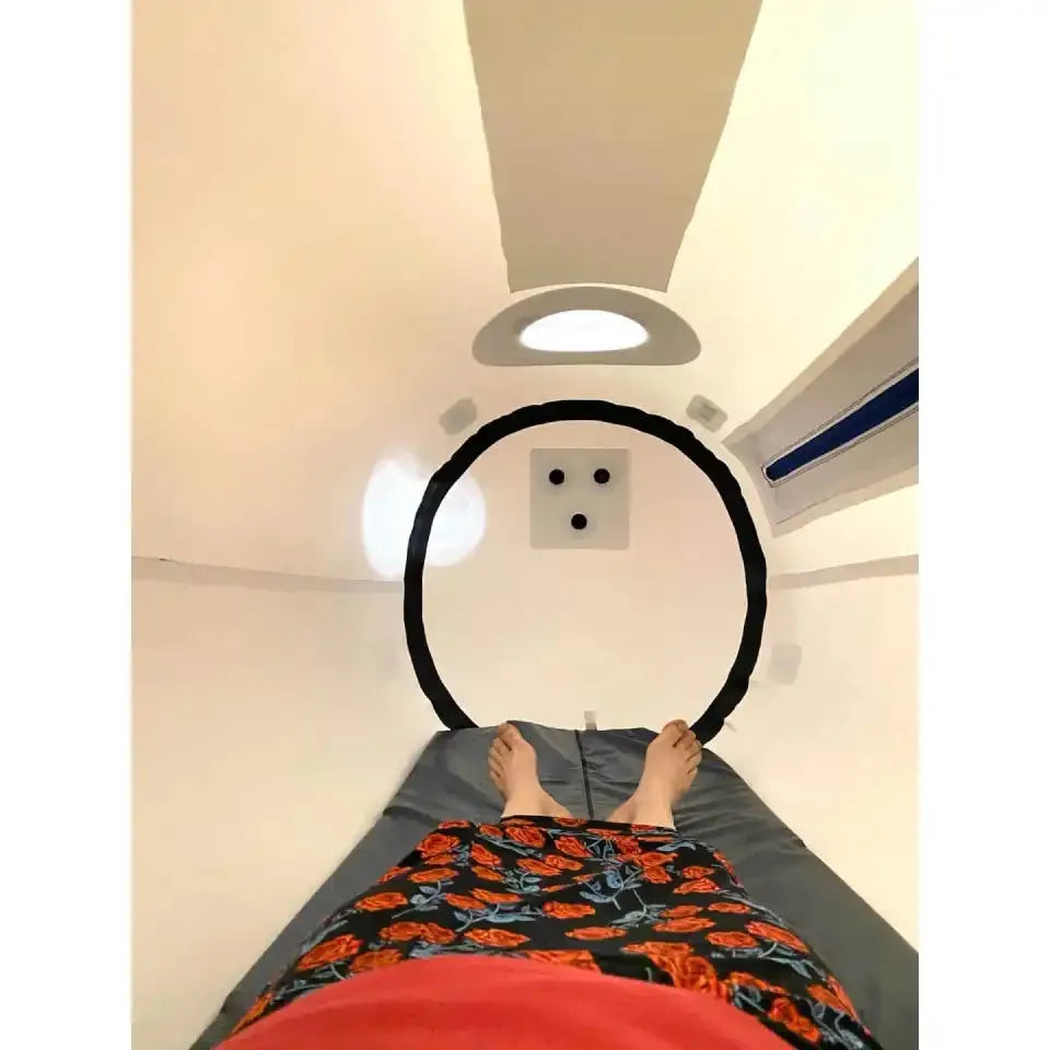 Newtowne Hyperbarics C4-40 Home Hyperbaric Chamber – person lying inside the chamber
