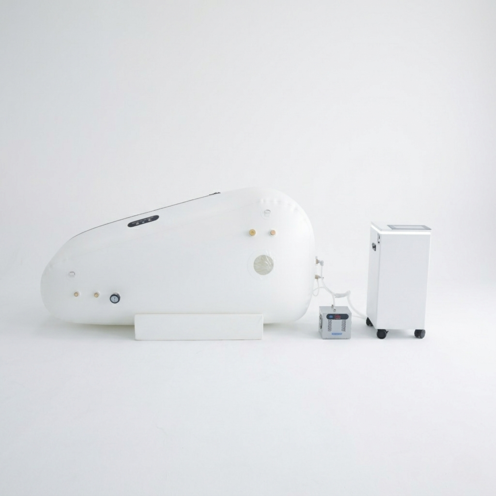 Oxyair OLV-RZT02 Soft Sitting Hyperbaric Chamber – chamber and concentrator on a gray background