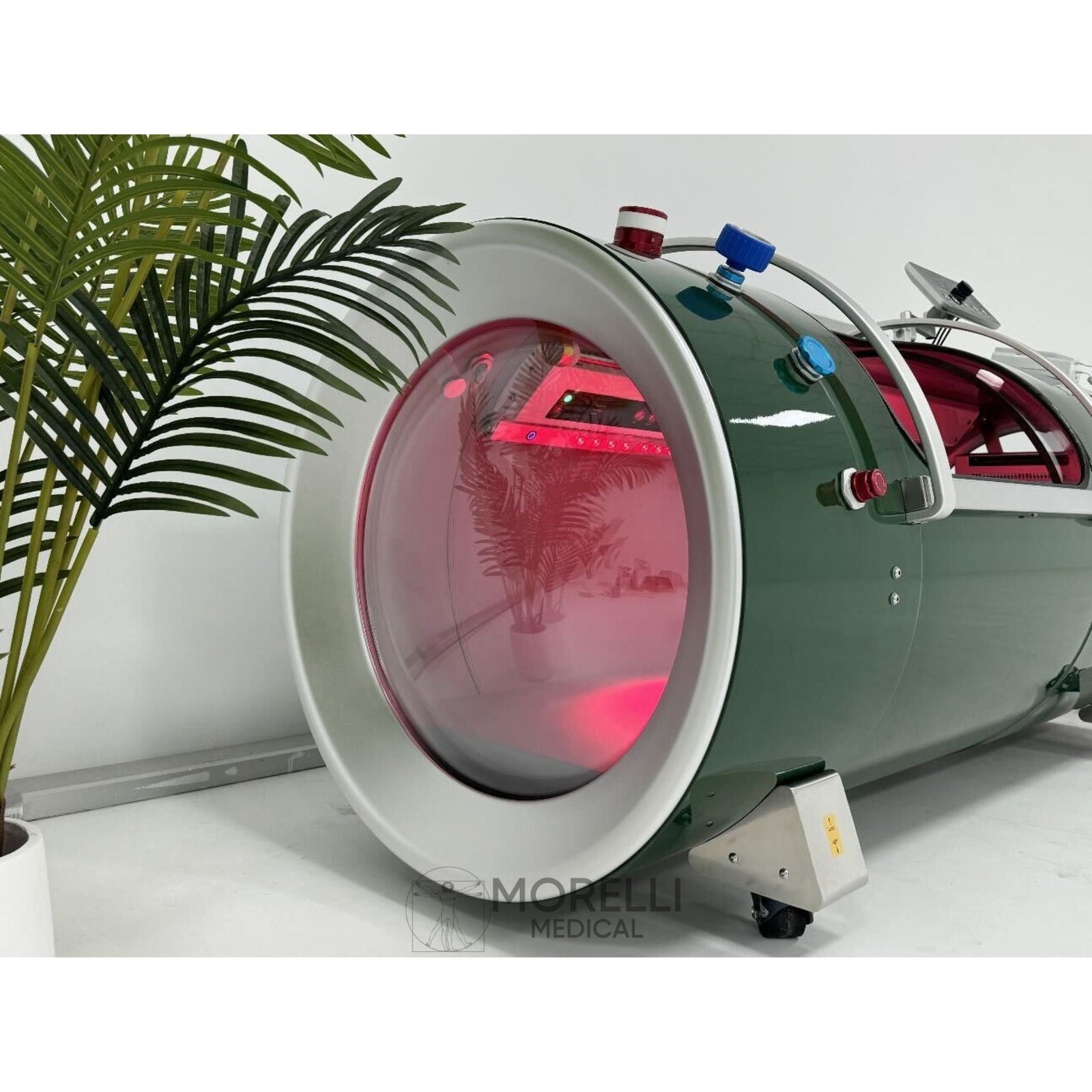 OxyRevo Quest30 Hard-Shell Hyperbaric Chamber – green chamber with red light glowing inside