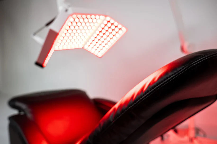 ApolloARC red light panel illuminated above treatment chair