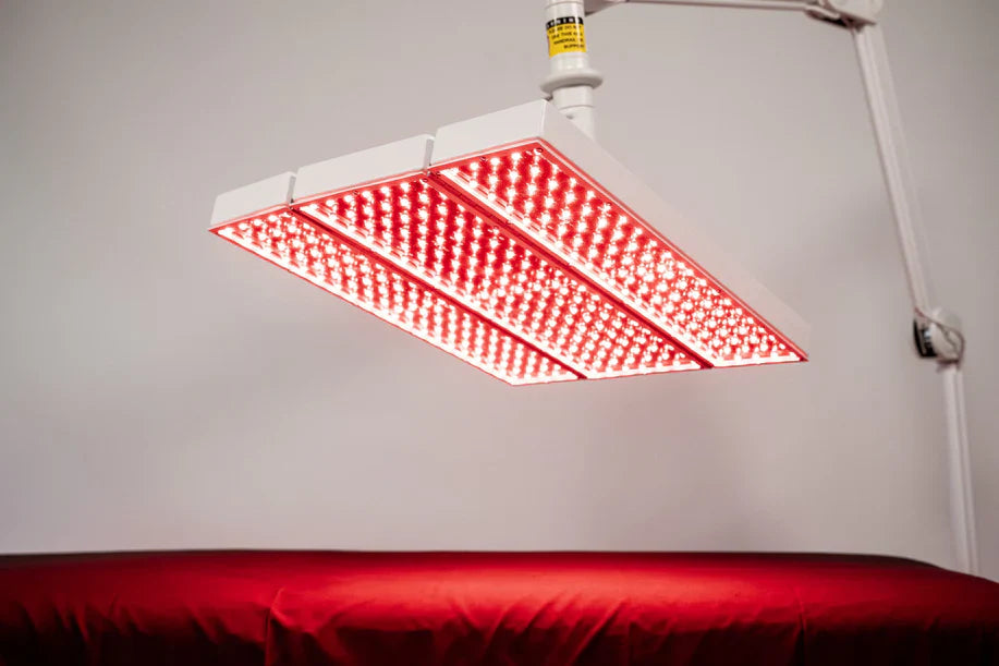 Close-up of the ApolloARC red light therapy canopy positioned over a treatment bed