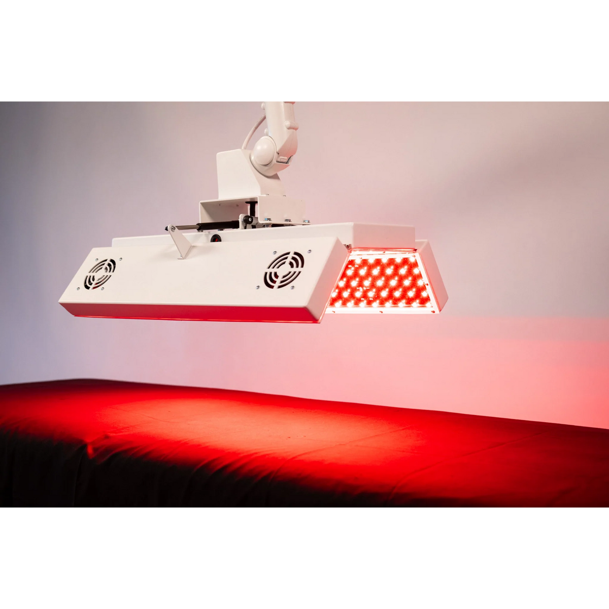 Body Balance System ApolloARC Red & Infrared Light Panel – panel over a table lit red