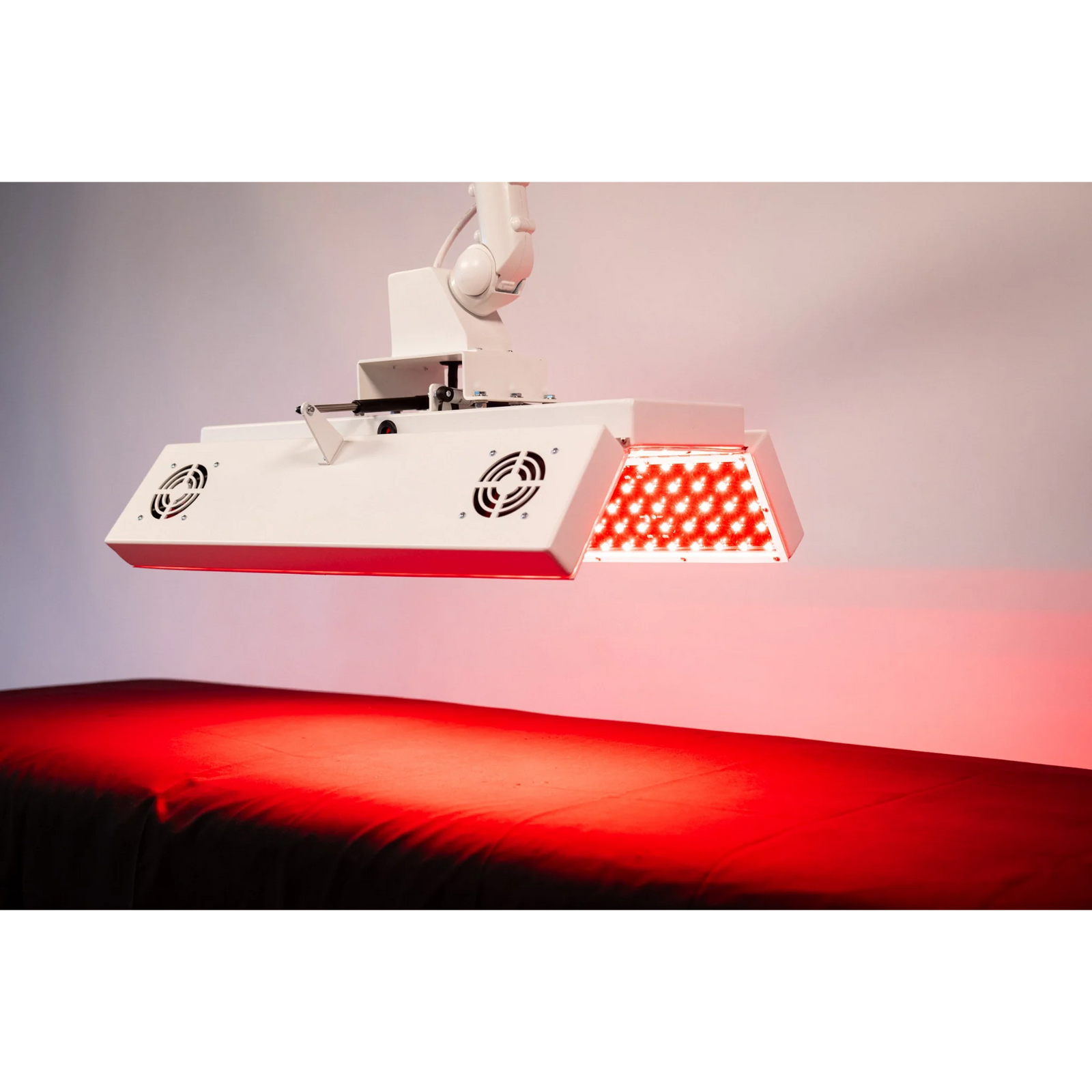 Body Balance System ApolloARC Red & Infrared Light Panel – panel over a table lit red