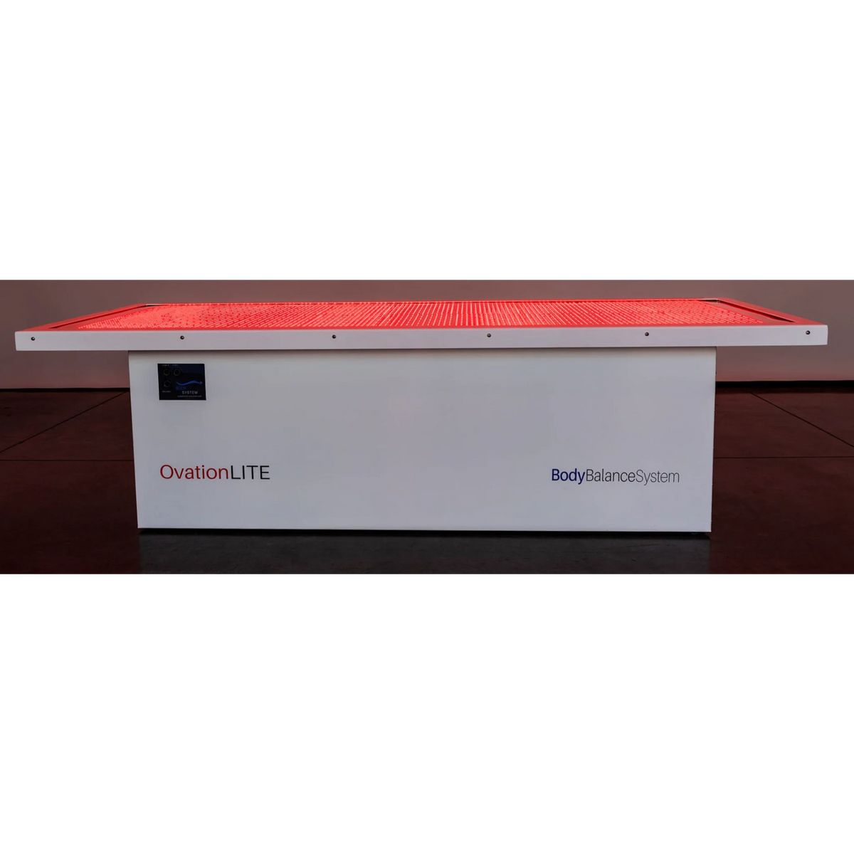 Body Balance System OvationLITE Zero Gravity Red & Infrared Light Bed – bed glowing red on a dark floor