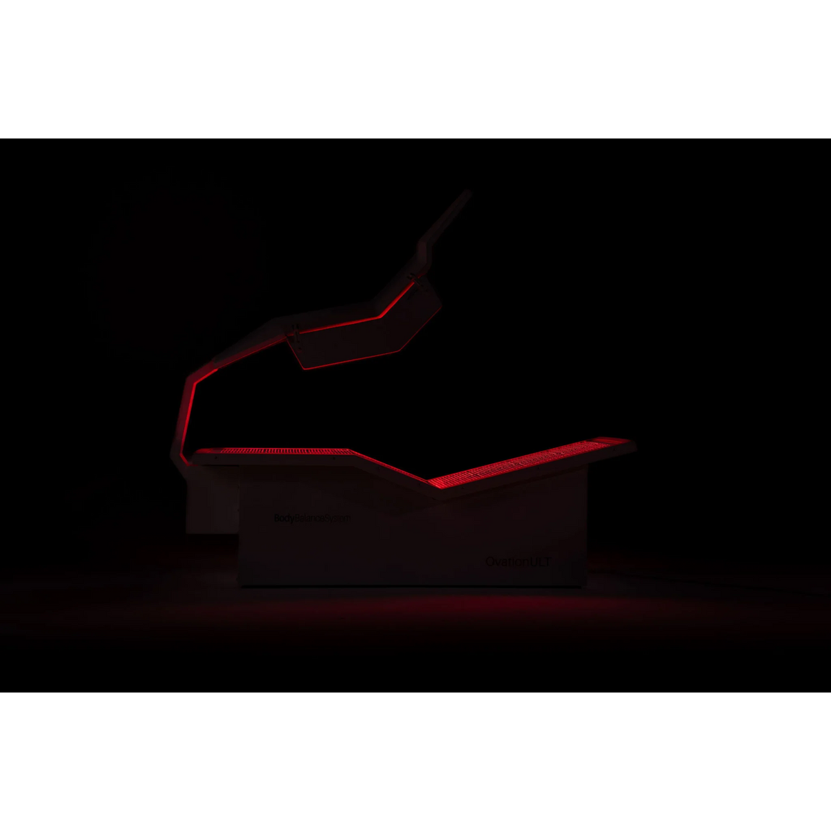 Body Balance System OvationULT Zero Gravity Red & Infrared Light Bed – bed glowing red in a dark room