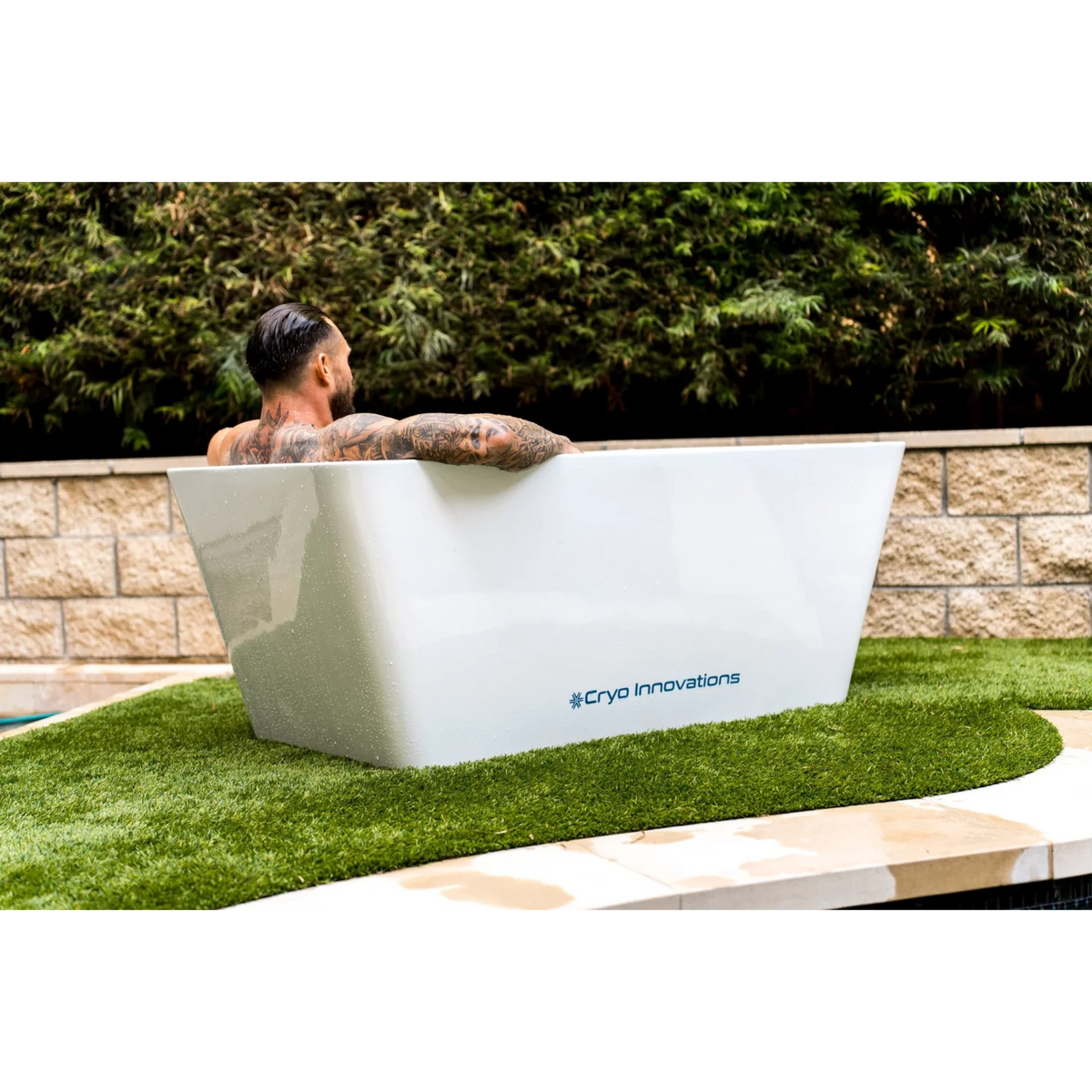 Cryo Innovations XR Cryo Plunge – man in the tub on a lawn