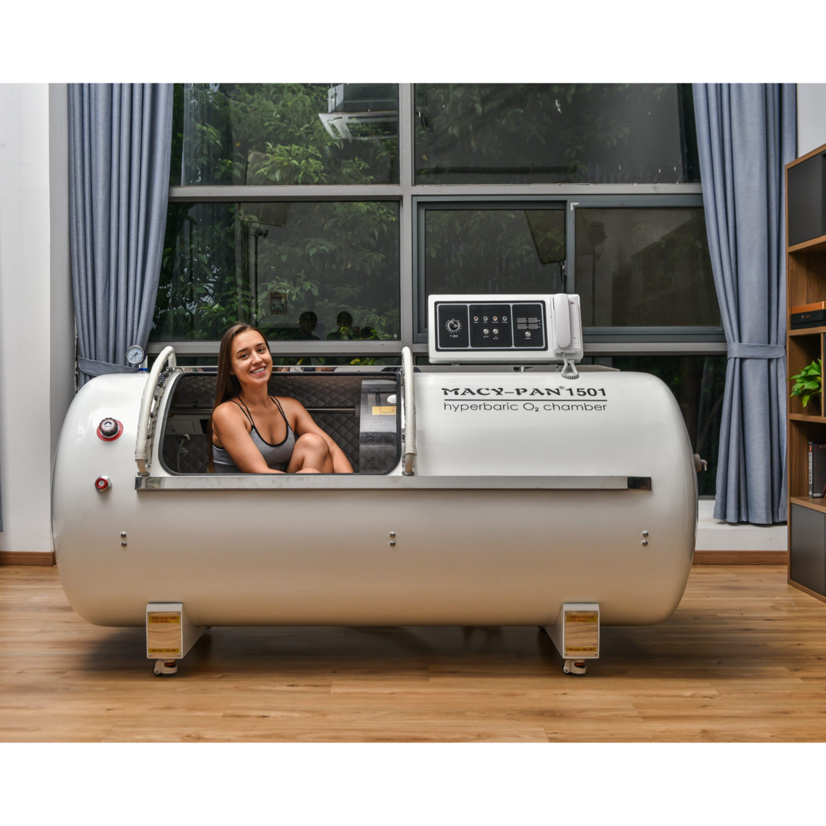 Macy-Pan HP1501 Hard-Shell Lying Hyperbaric Chamber – woman sitting inside the chamber