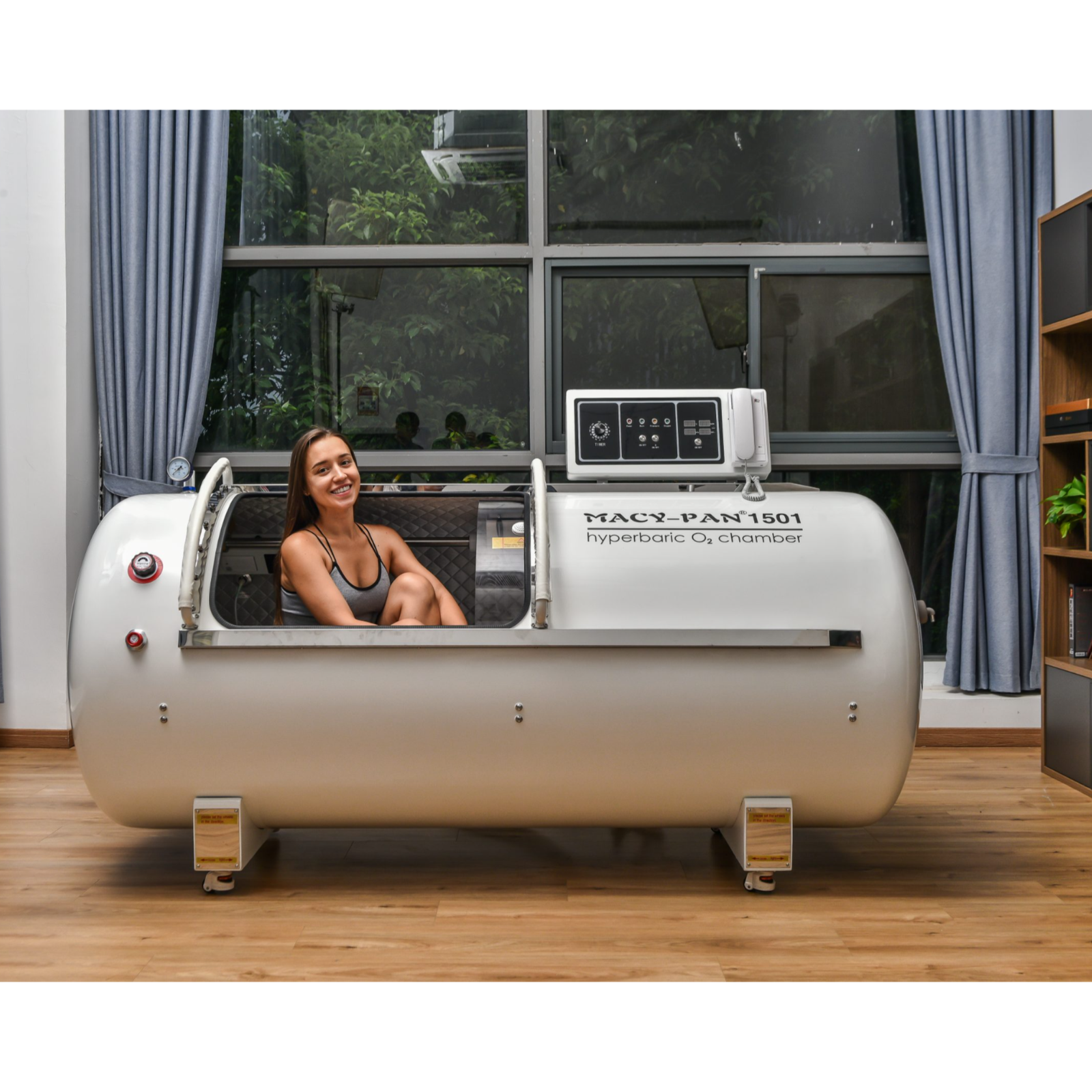 Macy-Pan HP1501 Hard-Shell Lying Hyperbaric Chamber – woman sitting inside the chamber