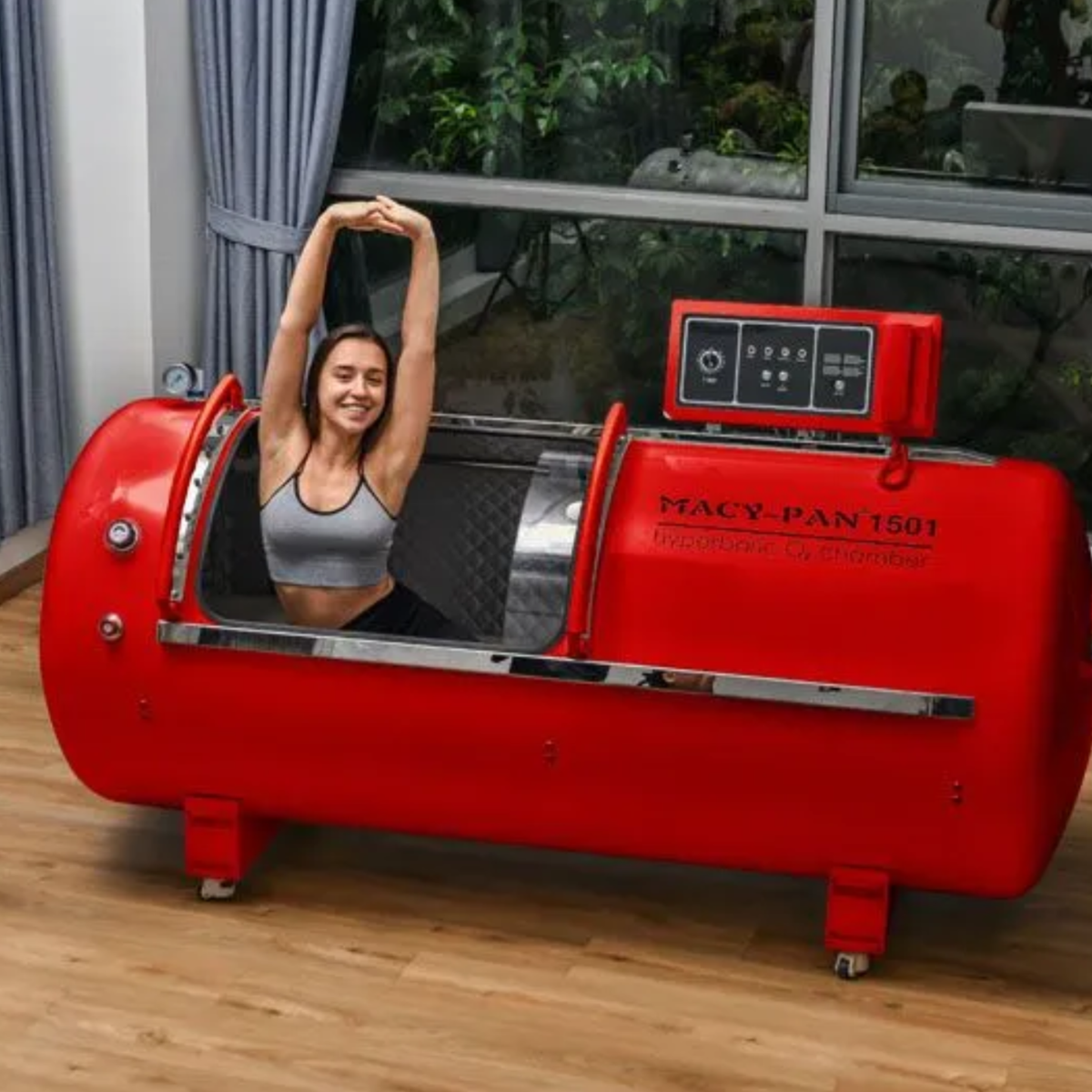 Macy-Pan HP1501 Hard-Shell Lying Hyperbaric Chamber – woman stretching inside the red chamber