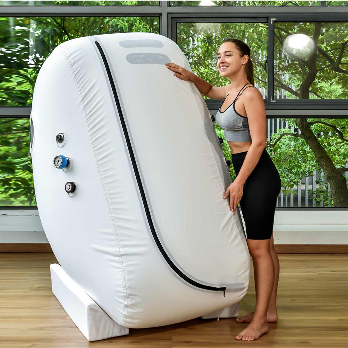 Macy-Pan L1 Sitting Hyperbaric Chamber – woman touching the chamber