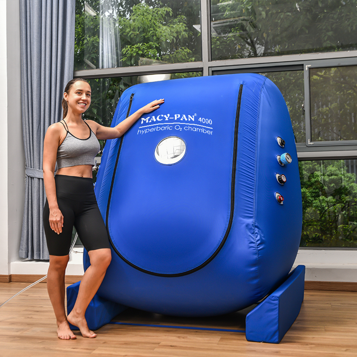 Macy-Pan MC4000 Wheelchair-Accessible Hyperbaric Chamber – woman standing beside the chamber