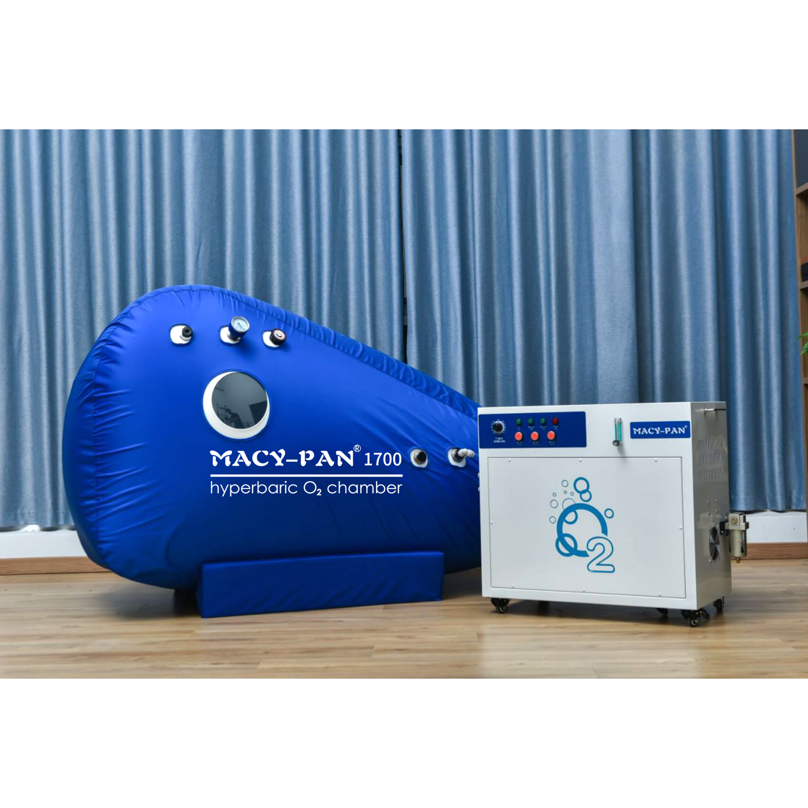 Macy-Pan ST1700 Compact Sitting Hyperbaric Chamber – blue sitting chamber next to an oxygen concentrator