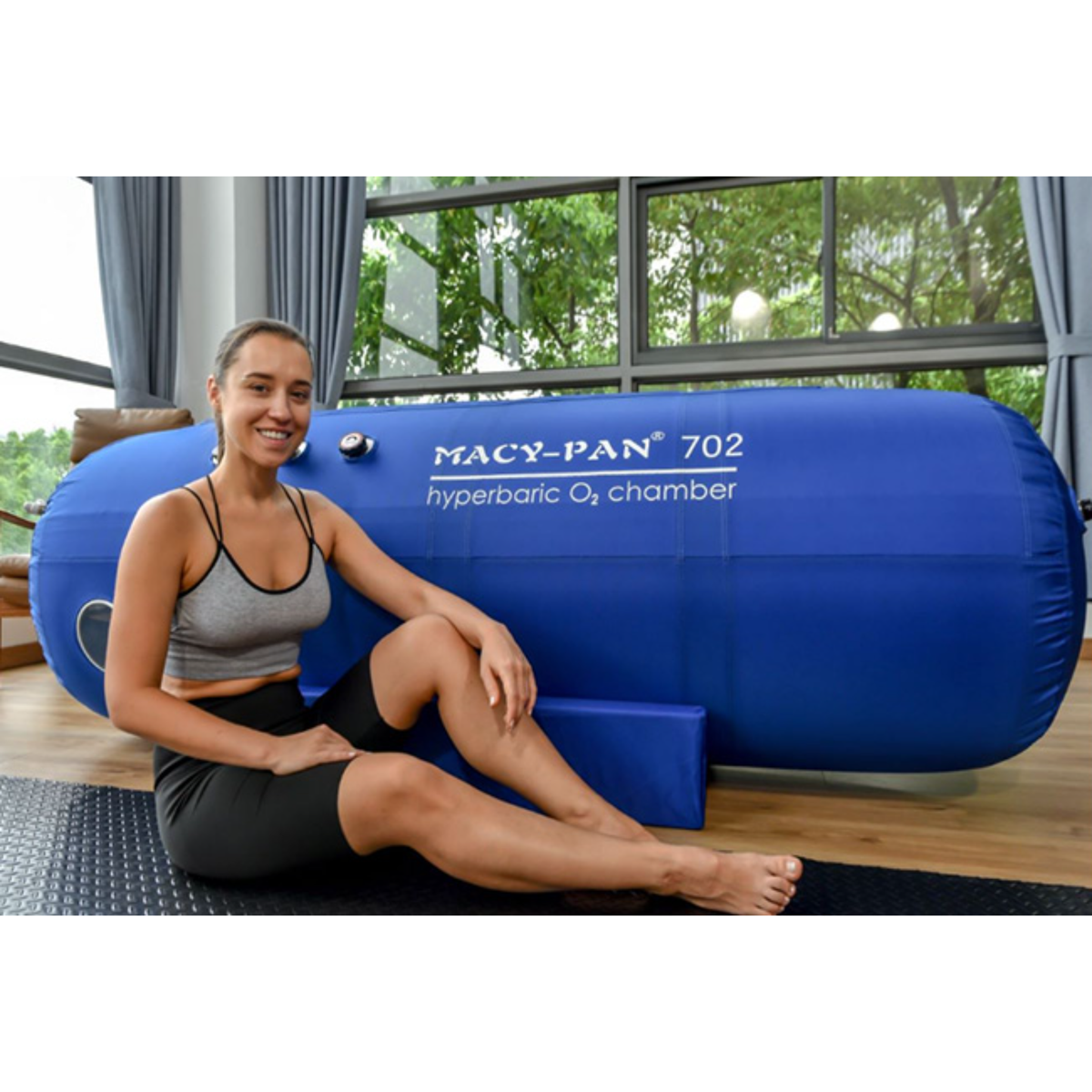 Macy-Pan ST702 Soft Lying Hyperbaric Chamber – woman sitting by the chamber