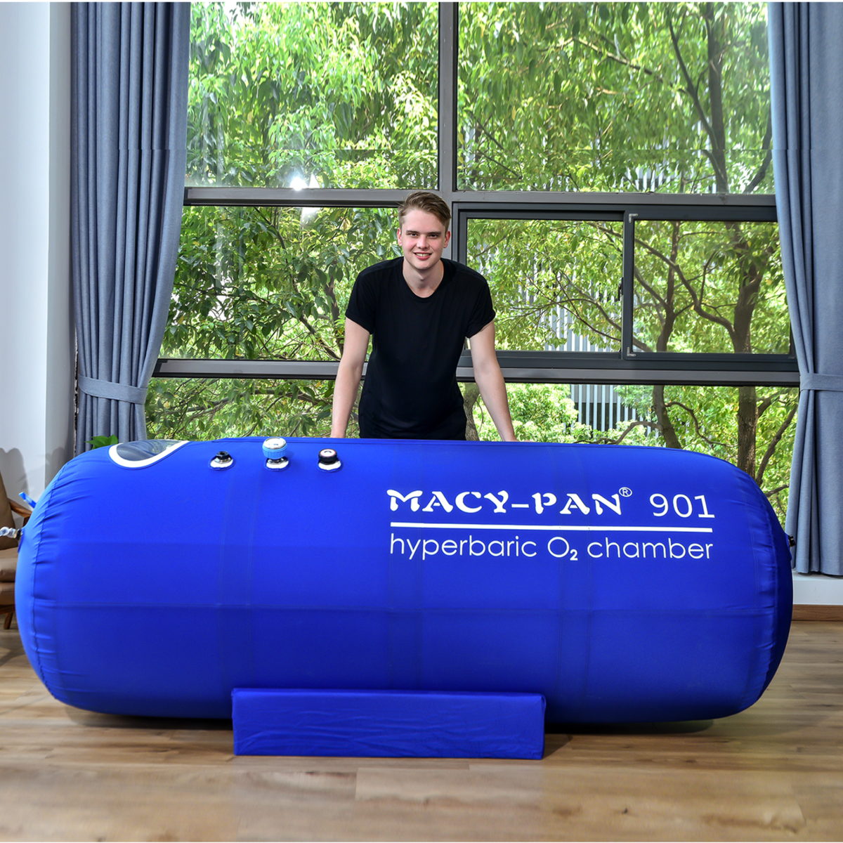 Macy-Pan ST901 Large Soft Lying Hyperbaric Chamber – man leaning on the chamber