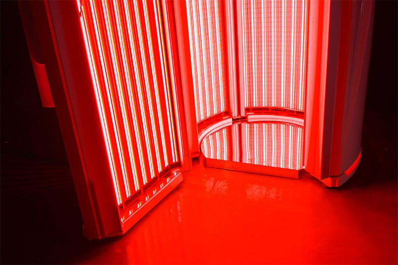 Merican M11 Plus stand-up red light therapy system, door open with LED panels lit