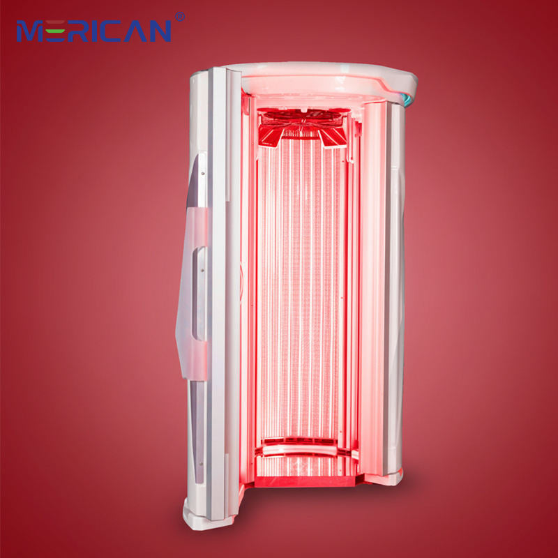 Merican M11 Plus stand-up red light therapy system in Lunar White, door open with red light on, red backdrop