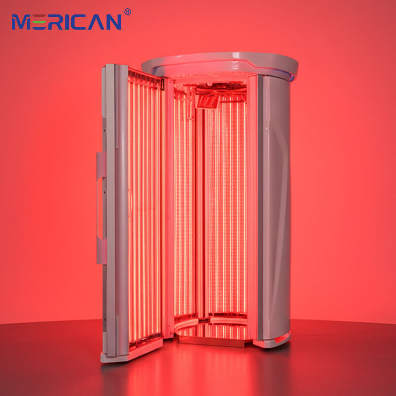 Merican M11 Plus stand-up red light therapy system in Lunar White, door open with red light on, shown in a room setting