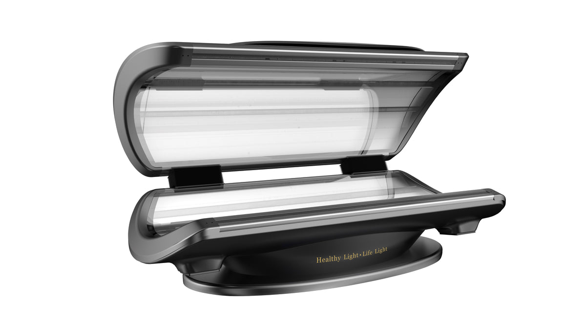 Merican MMB Plus whole-body red light therapy bed in Crystal Black, canopy open, angled view of the contoured cabin