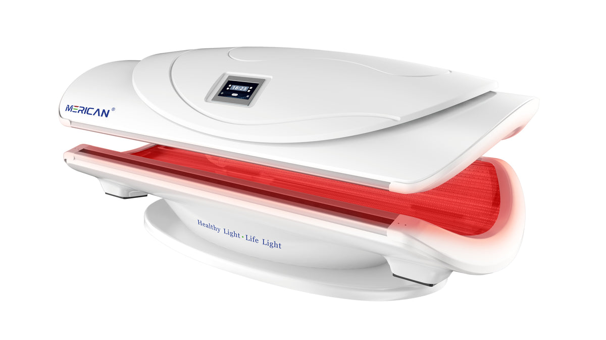 Merican MMB Plus whole-body red light therapy bed in Lunar White, canopy partly open with red light on, angled view