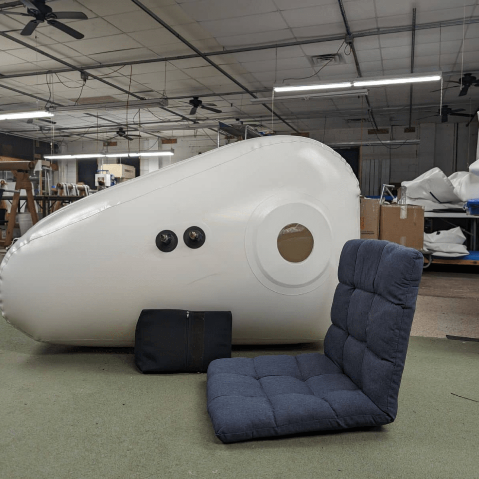Newtowne C4 Portable Shoe Hyperbaric Chamber – chamber in a workshop with a seat cushion