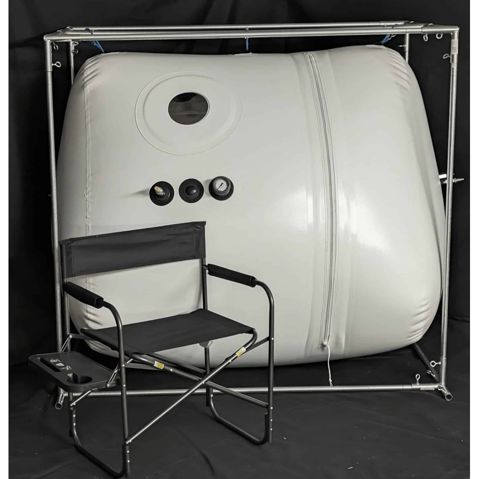 Newtowne C4-Tent Walk-In Hyperbaric Chamber – tent chamber on a steel frame beside a folding chair