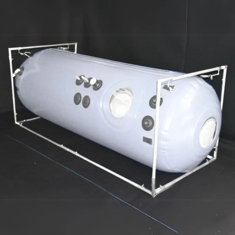 Newtowne Hyperbarics C4-27 Home Hyperbaric Chamber – chamber on a frame in a dark room