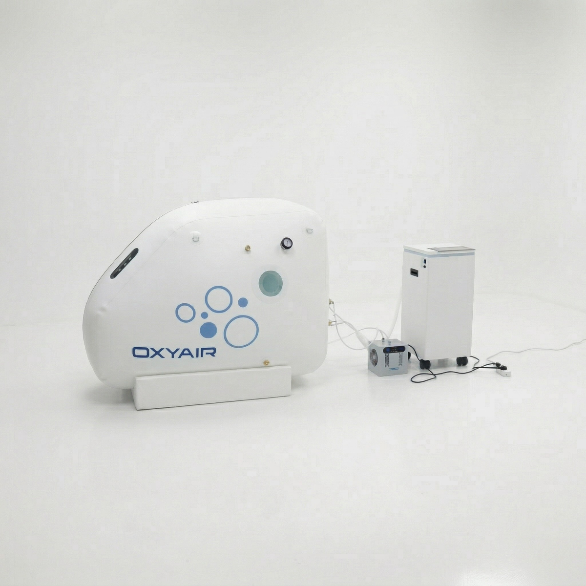 Oxyair OLV-RZ01 Portable Soft Sitting Hyperbaric Chamber – chamber at an angle beside its machine