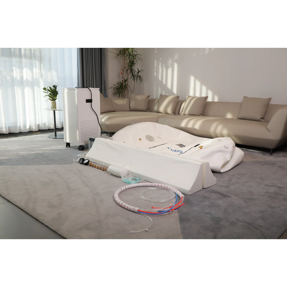 Oxyair OLV-RZT01 Soft Hyperbaric Chamber – chamber folded on the floor with its hoses