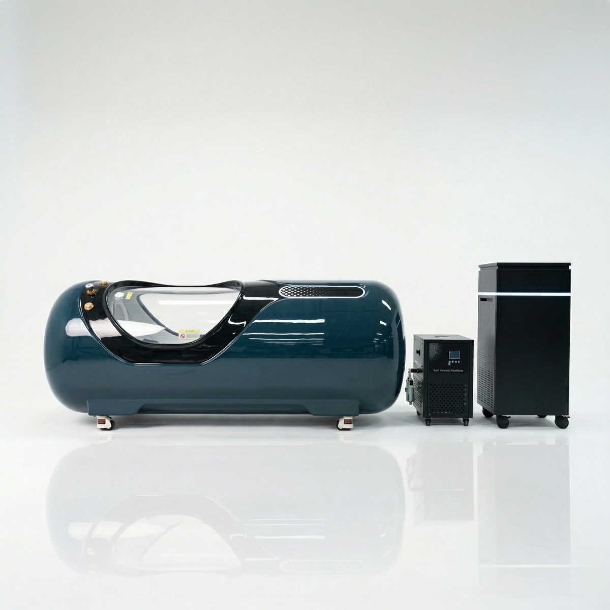 Oxyair OLV-YTD02 2.0 ATA Hard-Shell Hyperbaric Chamber – dark teal chamber beside its machines