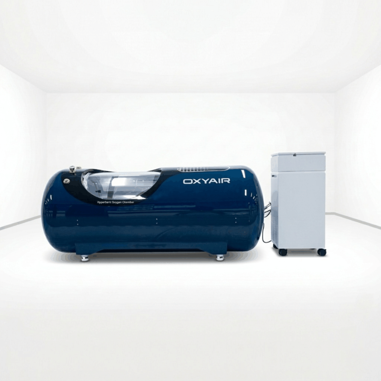 Oxyair OLV-YTD04 1.5–2.0 ATA Hard-Shell Hyperbaric Chamber – dark blue chamber in a white room