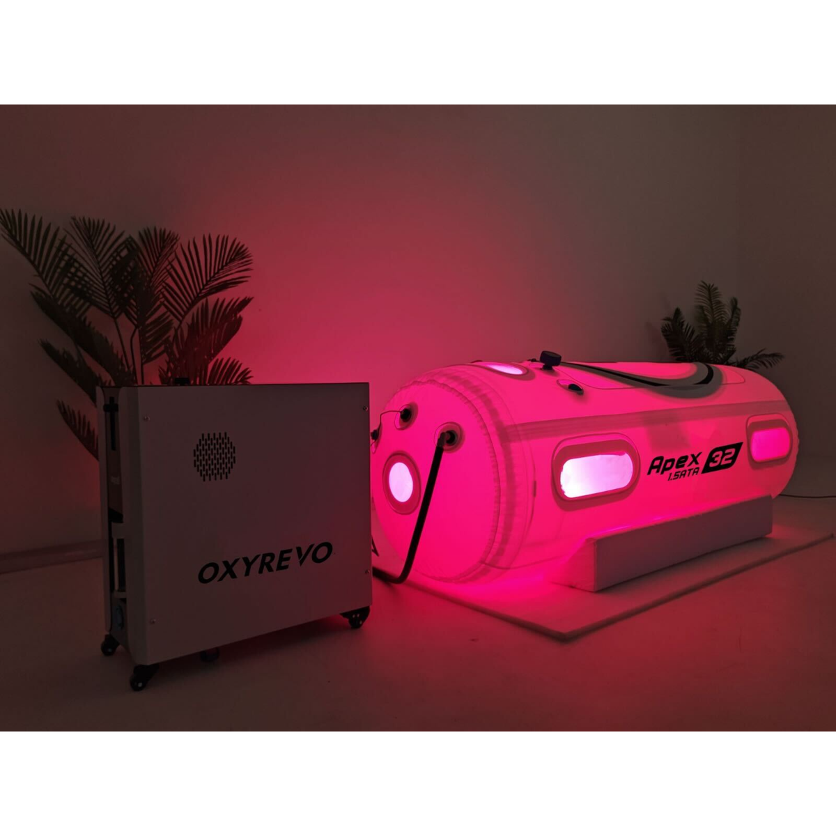 OxyRevo Apex32 Portable Soft Hyperbaric Chamber – chamber with red light glowing beside its machine