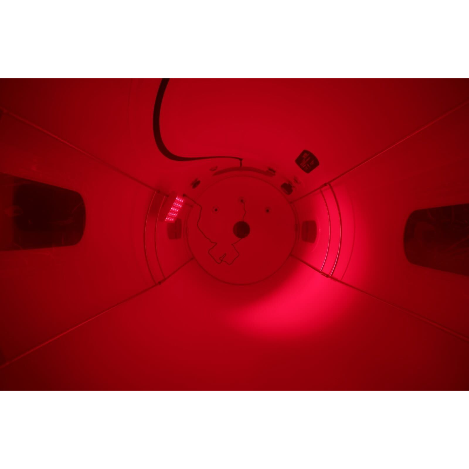 OxyRevo Apex32 Portable Soft Hyperbaric Chamber – red light glowing inside the chamber