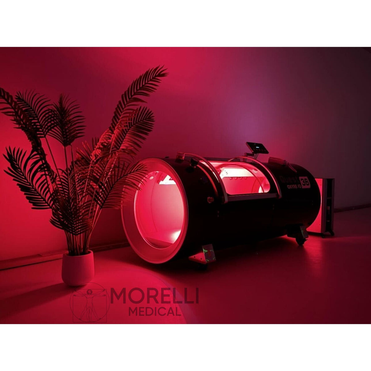 OxyRevo Quest36 Hard-Shell Hyperbaric Chamber – chamber with red light glowing in a dark room