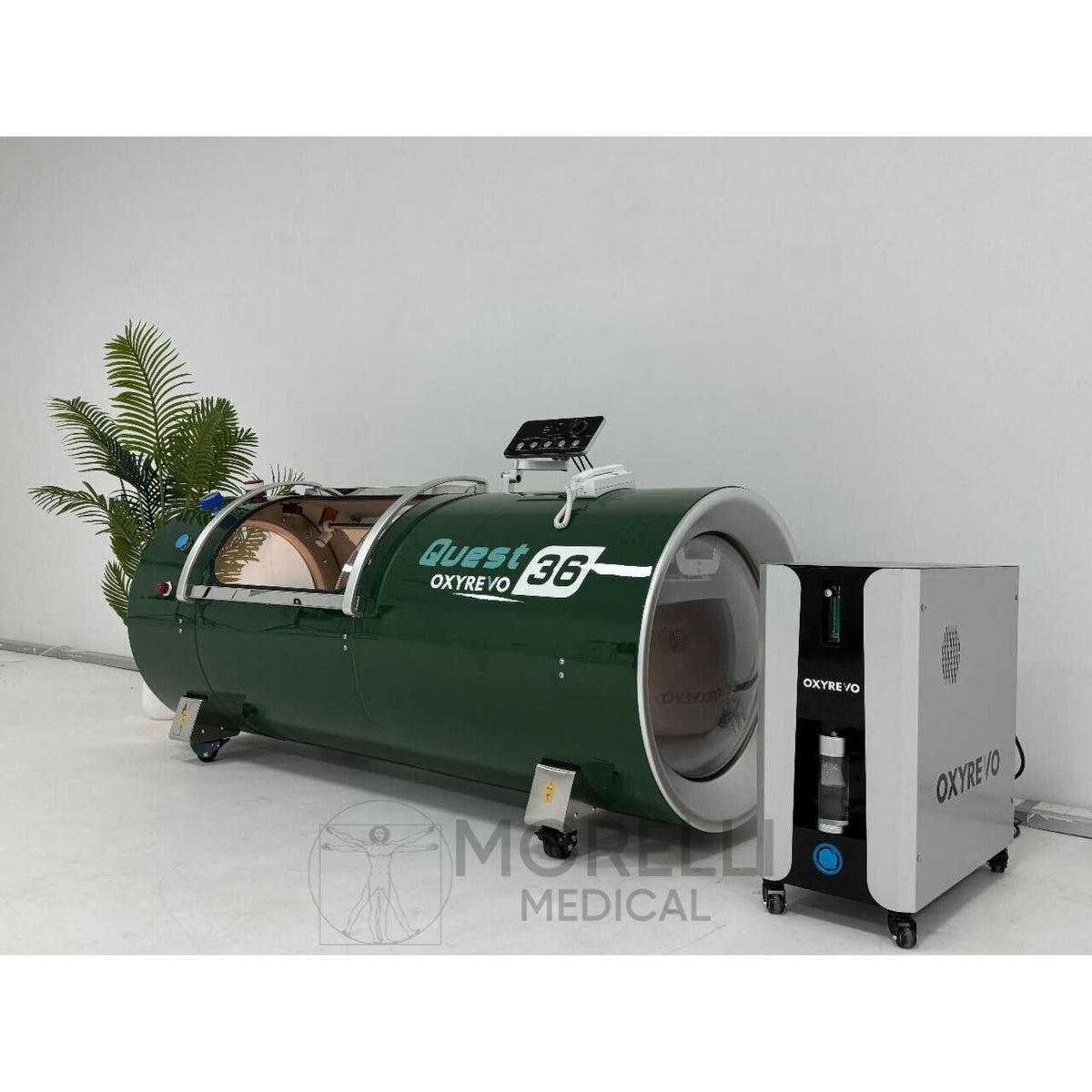OxyRevo Quest36 Hard-Shell Hyperbaric Chamber – green chamber beside its machine
