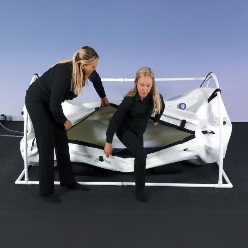 Summit to Sea Grand Dive 40" Hyperbaric Chamber – two people opening the chamber