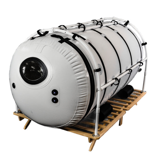 Summit to Sea Grand Dive Pro 46" Hyperbaric Chamber – three-quarter view on a wooden platform