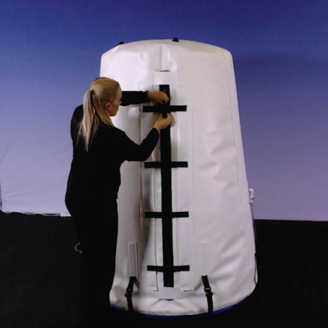 Summit to Sea Grand Dive Vertical 54" Upright Hyperbaric Chamber – person closing the zipper