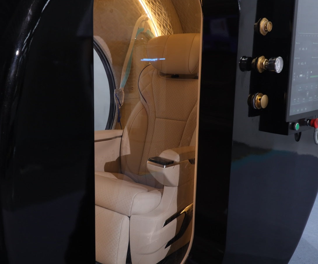 Oxyair OLV-YZD01 open door with leather seat and mask inside, external touch screen and gauge on the black shell